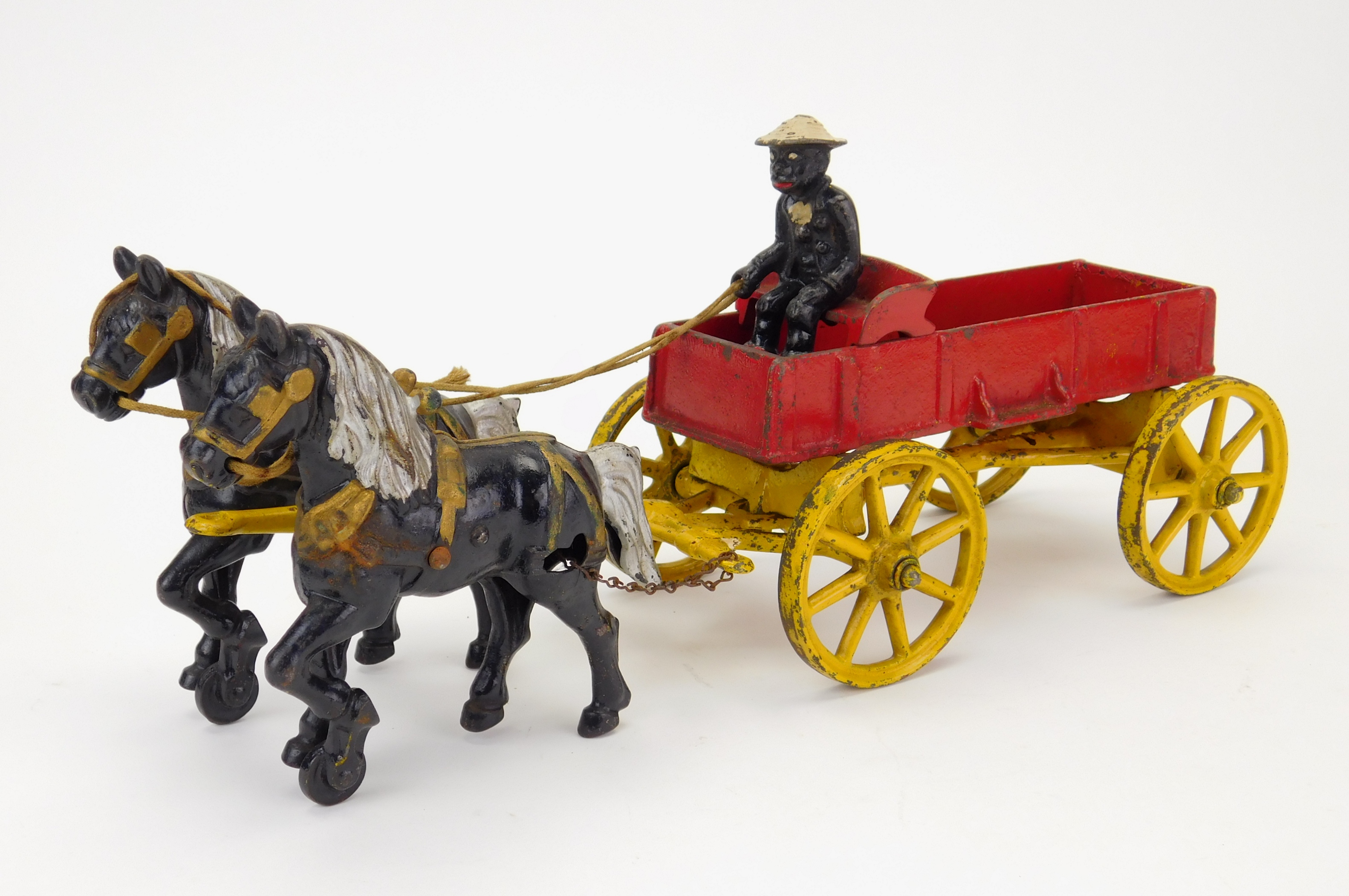 Appraisal: Kenton Toys cast iron horse drawn dray wagon with black