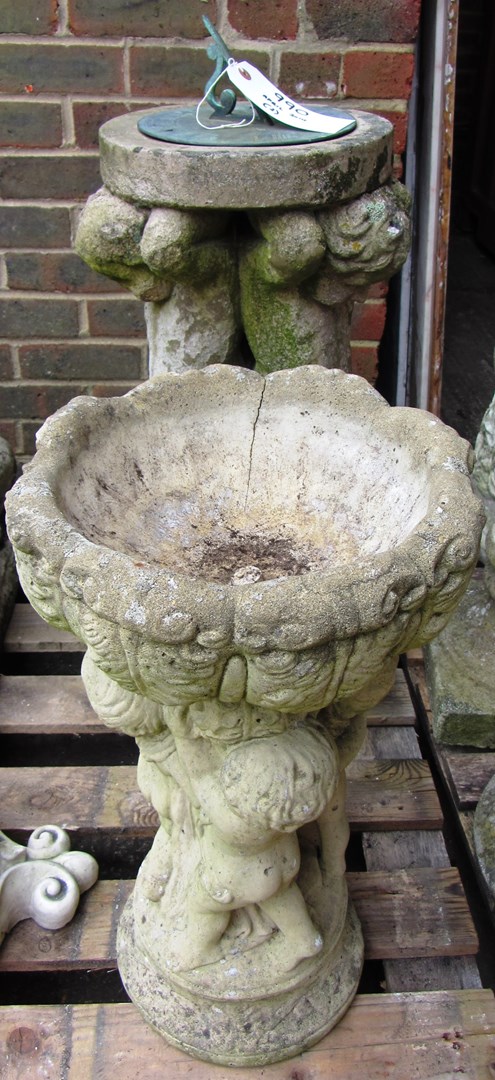 Appraisal: A reconstituted stone sundial the column modelled as three cherubs