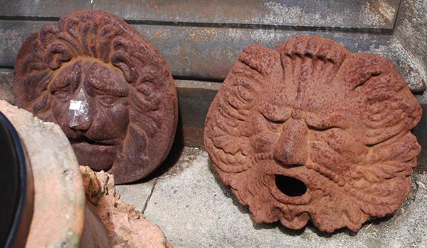 Appraisal: TWO CASK IRON MASK WALL FOUNTAIN HEADS one fountain head