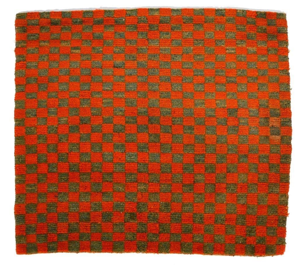 Appraisal: Handmade Tibetan checkerboard rug Green and orange in color Circa