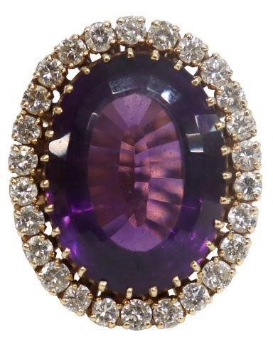 Appraisal: Estate kt yellow gold ring center oval cut amethyst surrounded