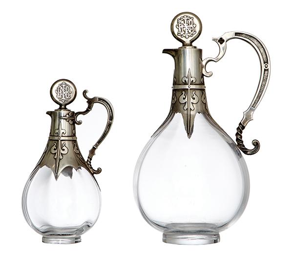 Appraisal: A GRADUATED PAIR OF ART DECO FRENCH SILVER MOUNTED BOTTLES