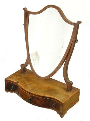 Appraisal: A George III style mahogany shield shape dressing table mirror