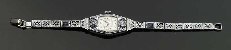 Appraisal: BULOVA LADIES WRISTWATCH Watch accented with synthetic blue sapphire melees