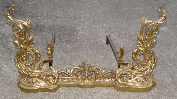 Appraisal: FRENCH BRASS FIREPLACE CHENETS Brass and cast metal foliate scroll