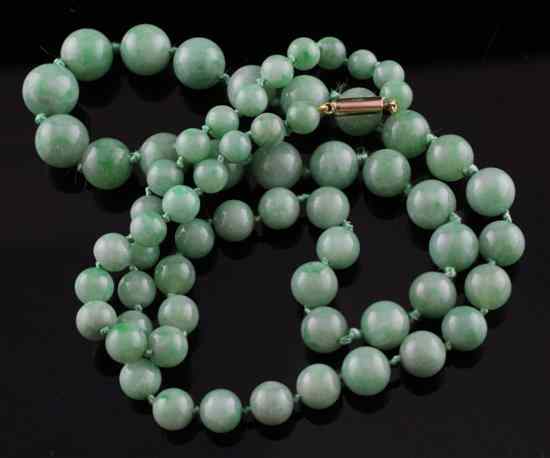 Appraisal: A graduated jadeite bead necklace with ct gold clasp in