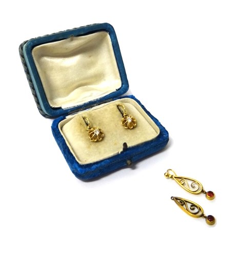 Appraisal: A pair of gold and diamond set single stone earrings