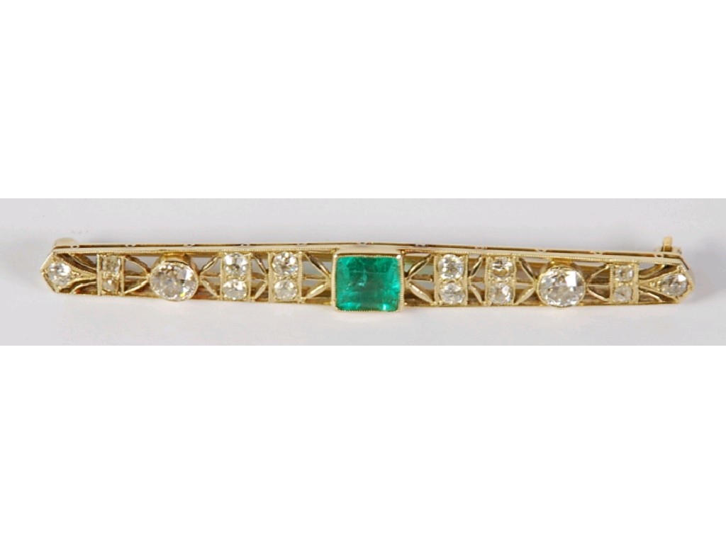 Appraisal: PRE WAR GOLD EMERALD AND DIAMOND OPENWORK BAR BROOCH set