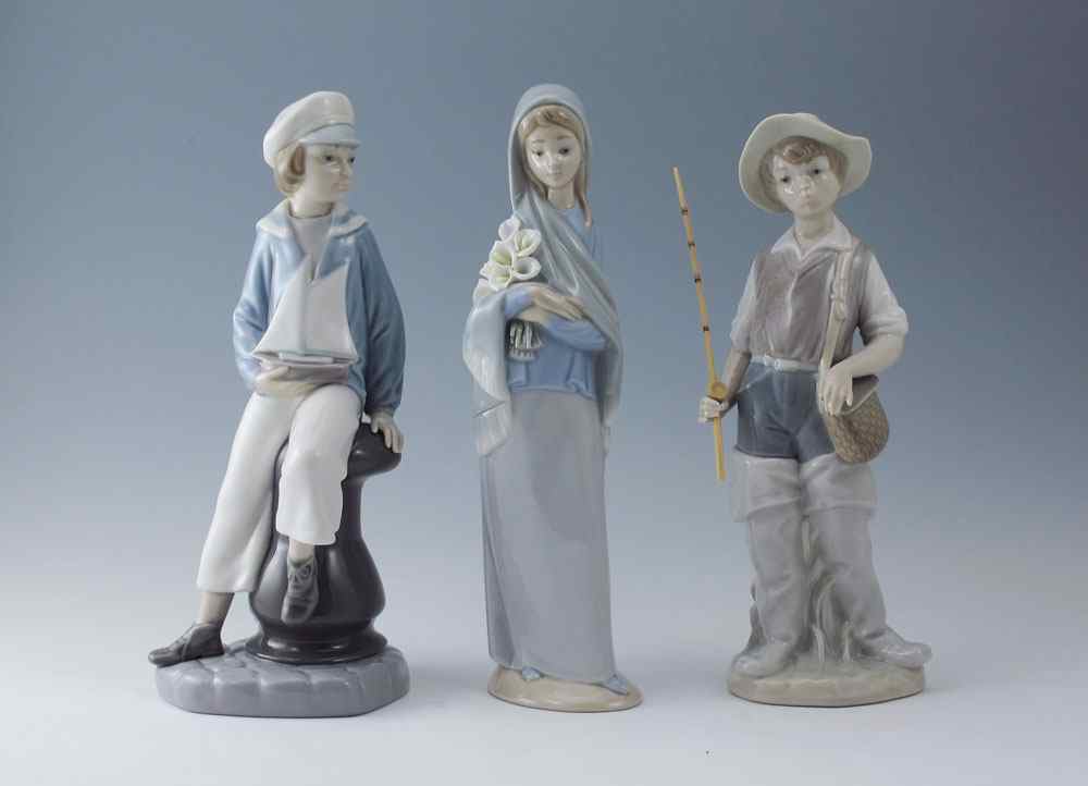 Appraisal: THREE LLADRO PORCELAIN FIGURINES To include GOING FISHING glazed Salvador