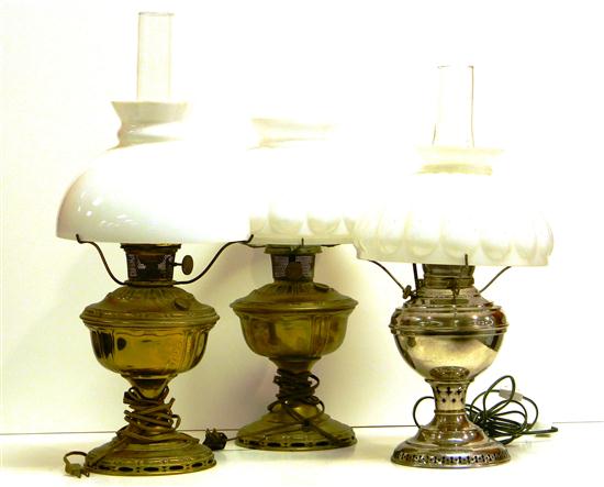 Appraisal: Three table top fluid lamps pair brass base one nickel