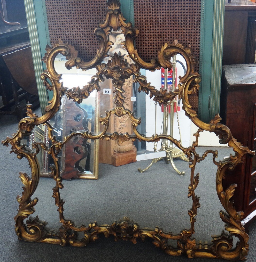 Appraisal: A th century lozenge shaped gilt framed overmantel mirror with