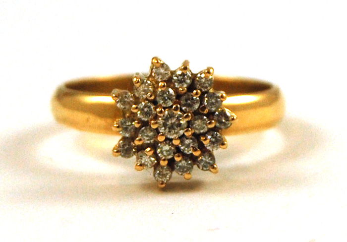 Appraisal: DIAMOND AND FOURTEEN KARAT GOLD RING set with round-cut diamonds