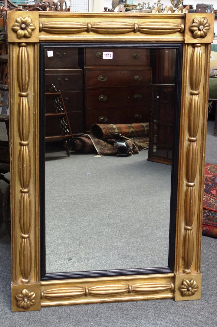 Appraisal: A Regency gilt framed overmantel mirror with waisted reeded decoration