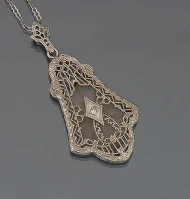 Appraisal: An Art Deco Camphor Glass Gold and Diamond Pendant k