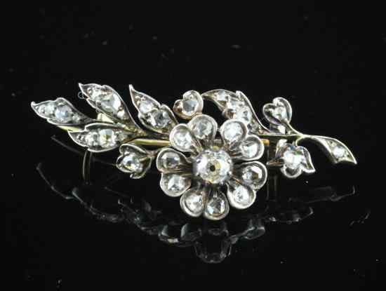 Appraisal: A late Victorian diamond set gold flower brooch ins Estimate