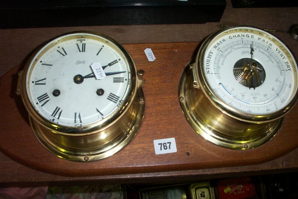 Appraisal: A Schatz marine clock in a brass case with -day