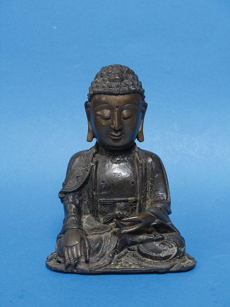 Appraisal: A SINO-TIBETAN BRONZE of a seated deity probably th th