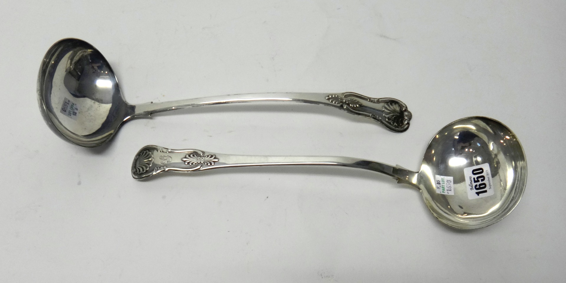 Appraisal: A Scottish Silver single struck shell pattern soup ladle Edinburgh