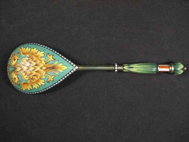 Appraisal: A large Russian gold washed silver spoon with an enameled