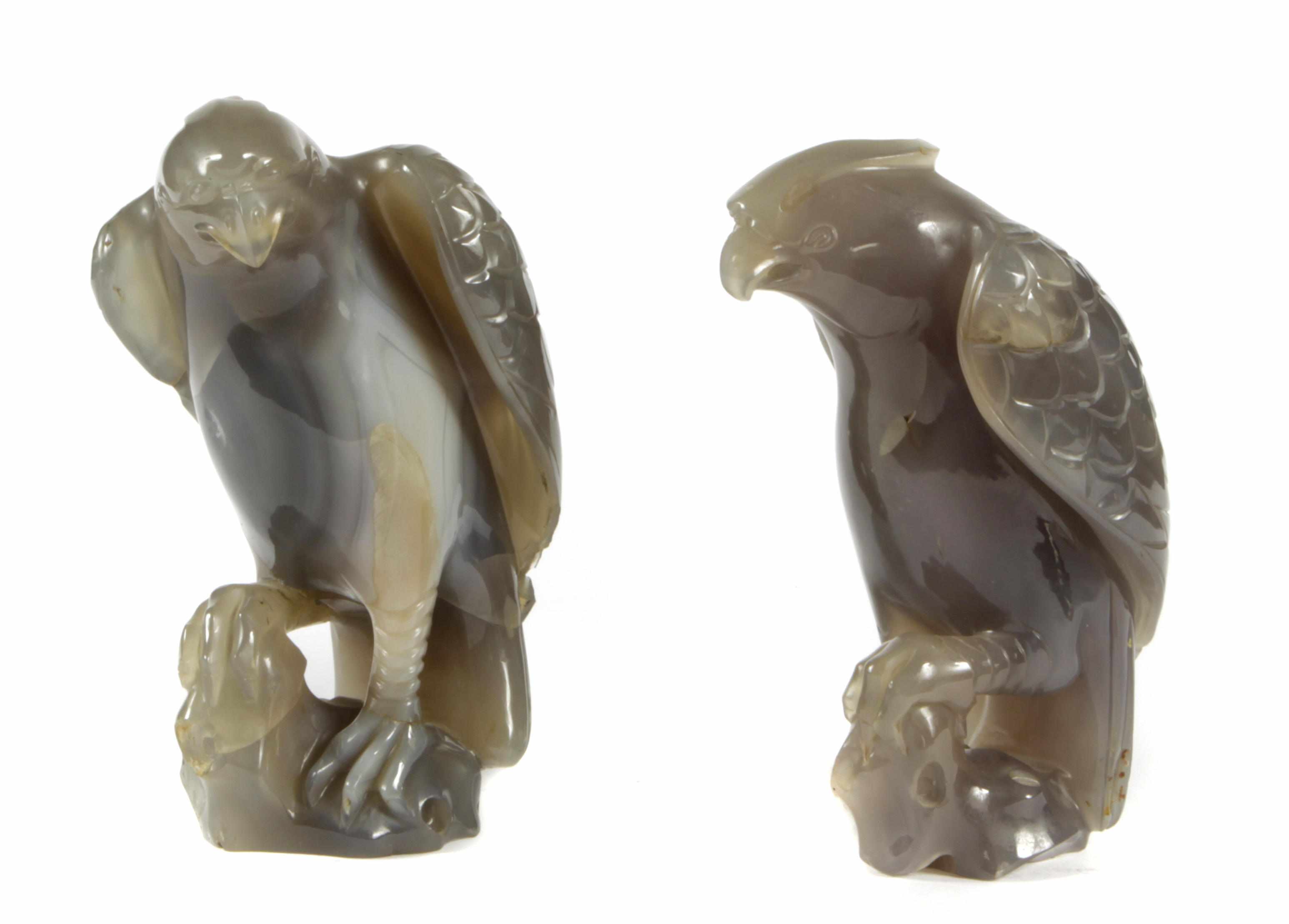 Appraisal: A pair of carved stone falcons height in