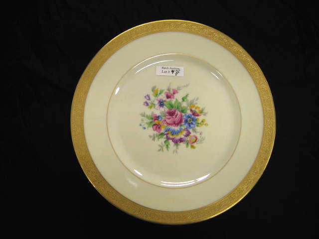 Appraisal: Set of French Porcelain Dinner Plates floral bouquet gold encrusted