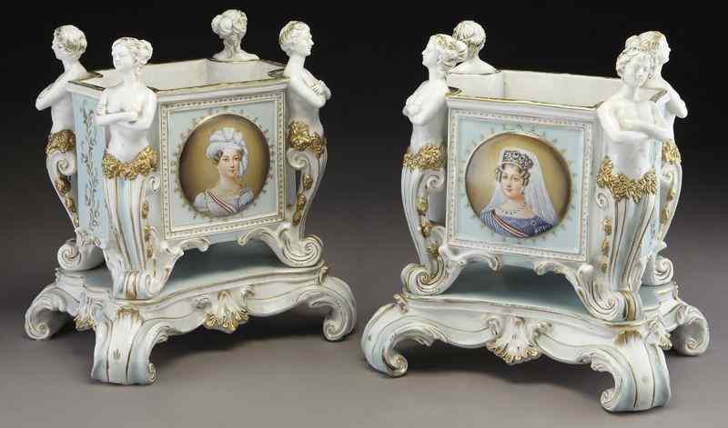 Appraisal: Pr German porcelain jardinieresmodeled with male and female bust terminals