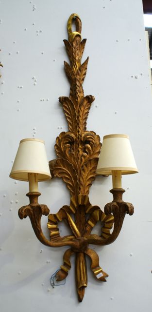 Appraisal: a pair of Italian rococo style two light wall sconces