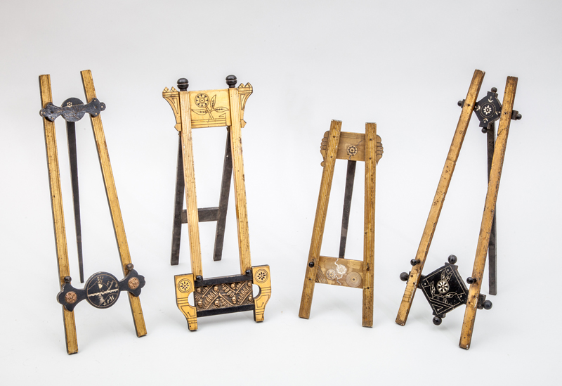 Appraisal: FOUR AESTHETIC MOVEMENT TABLE-TOP EASELS Gilt and black painted gessoed