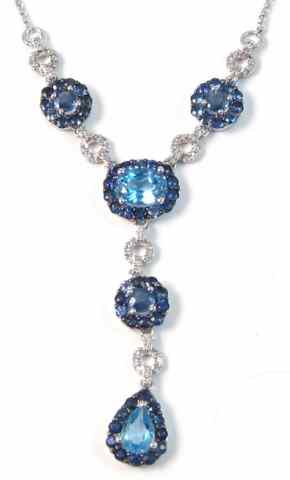 Appraisal: SAPPHIRE BLUE TOPAZ AND DIAMOND NECKLACE set between two equal