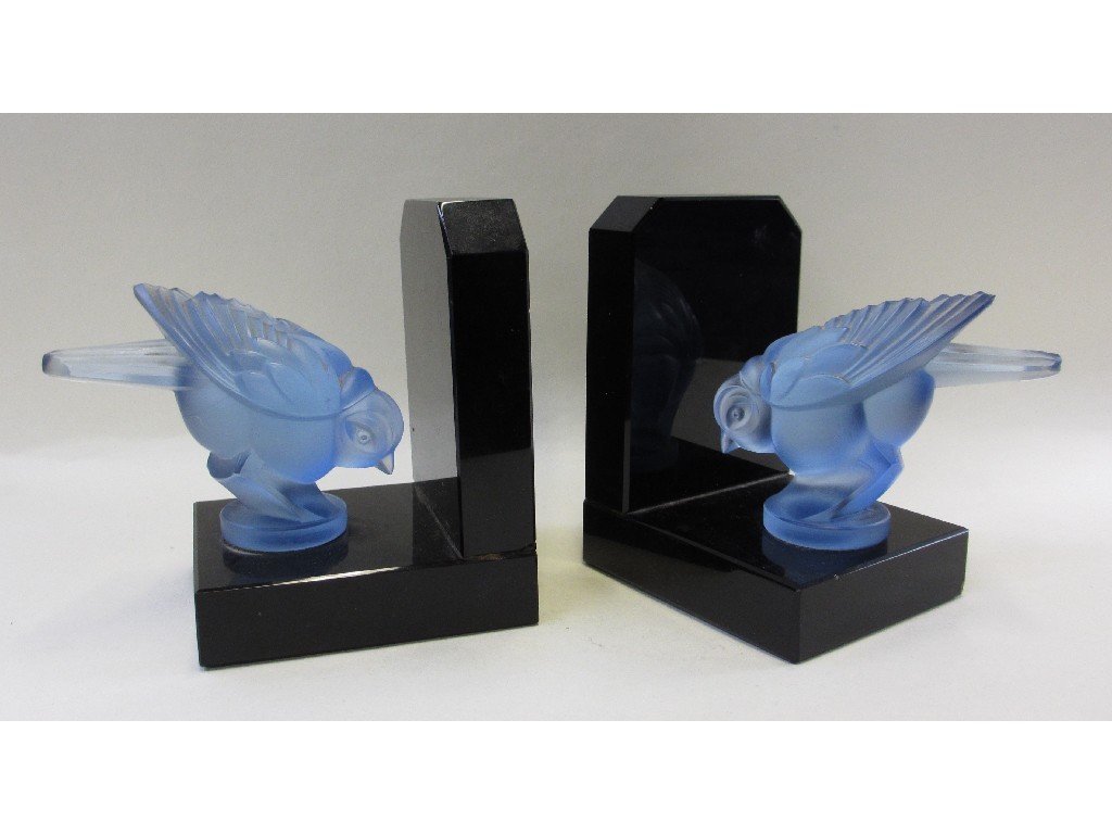 Appraisal: Pair of frosted blue glass bird bookends on black glass