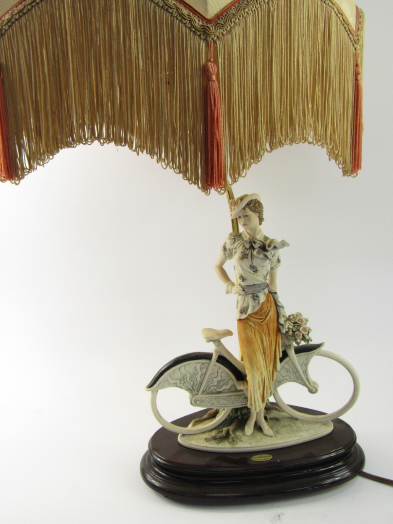 Appraisal: A Florence figural table lamp with a young woman on