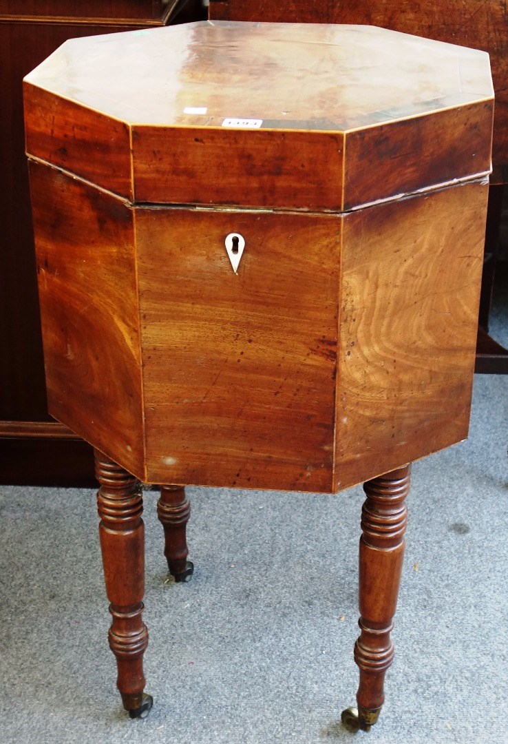 Appraisal: A Regency rosewood banded mahogany octagonal cellarette on turned supports