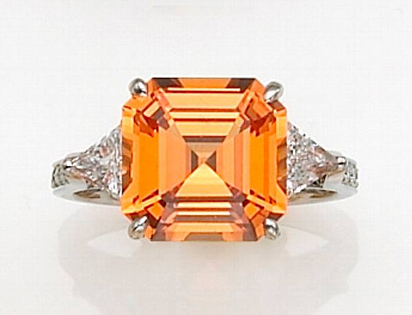 Appraisal: A mandarin garnet diamond and platinum ring Paolo Costagli centering