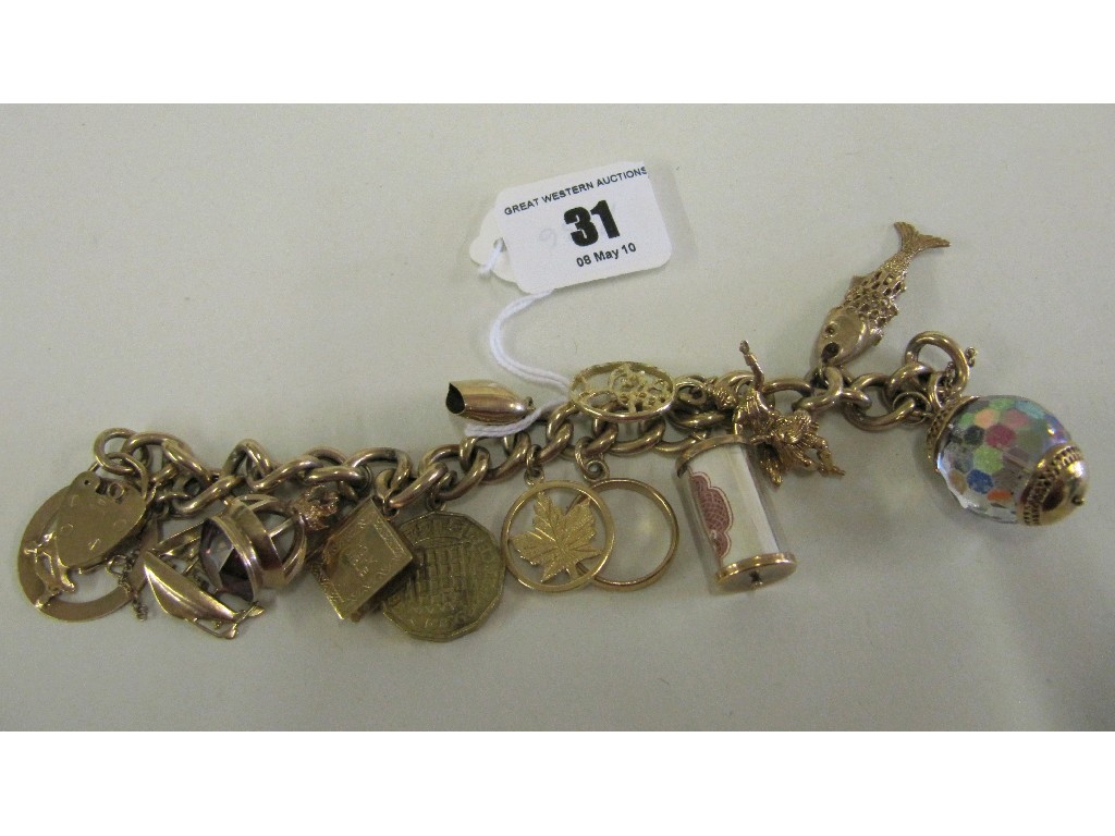 Appraisal: Nine carat gold charm bracelet with twelve various gold charms