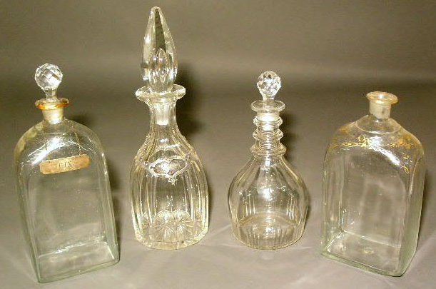 Appraisal: Four clear glass decanters and two wine labels