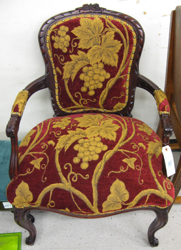 Appraisal: LOUIS XV STYLE ARMCHAIR having a carved and molded mahogany