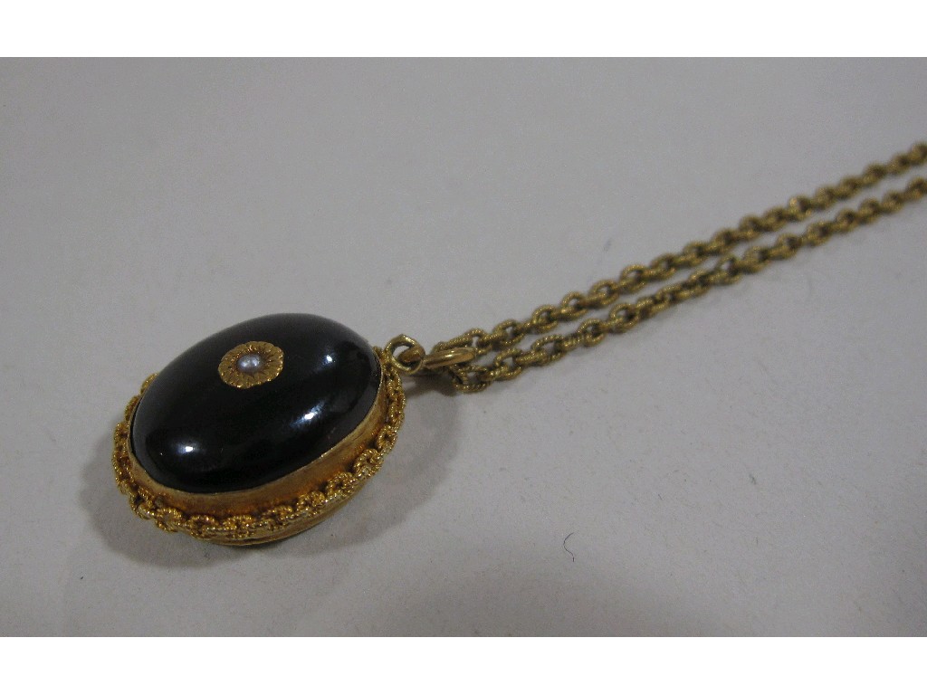 Appraisal: Victorian cabochon garnet remembrance pendant in unmarked gold mount and