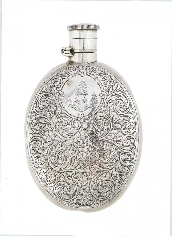 Appraisal: A VICTORIAN SILVER HIP FLASK one side engraved with flowers