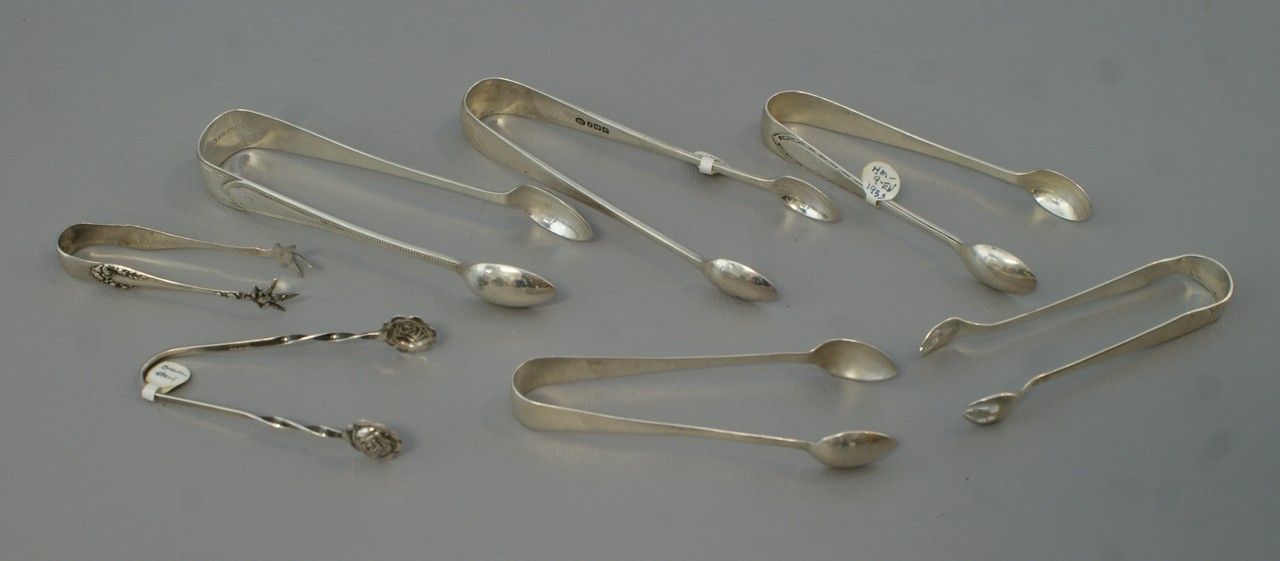 Appraisal: pr various sterling tongs longest TO