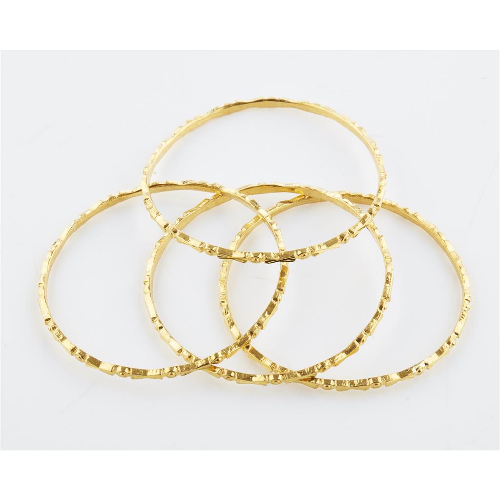 Appraisal: A set of four bangles each modelled in unmarked yellow