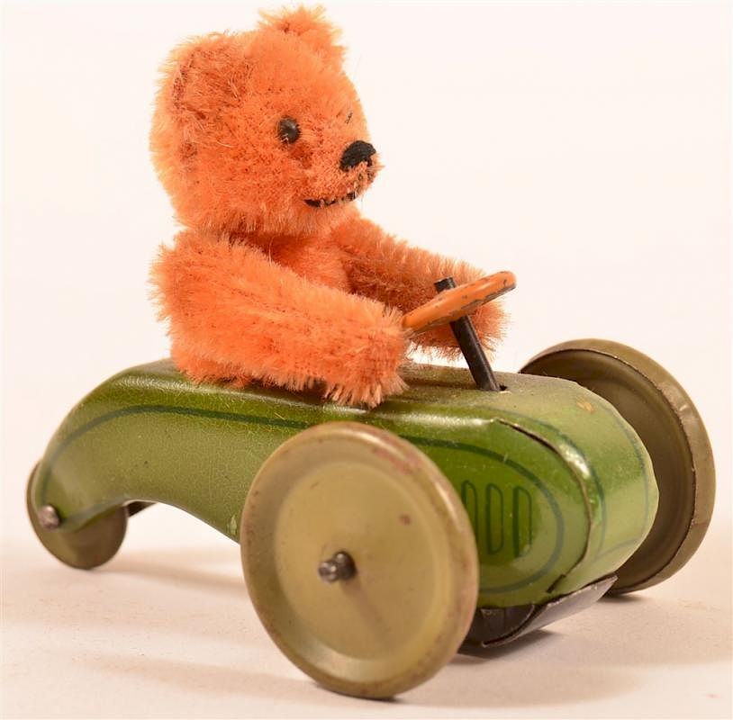 Appraisal: Vintage Schuco Teddy Bear in Three Wheel Car Vintage Schuco