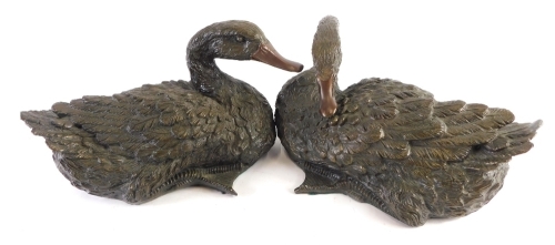 Appraisal: A pair of bronzed resin figures of ducks unmarked cm