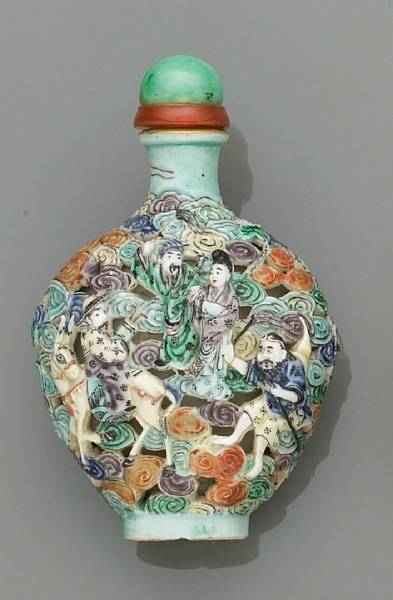 Appraisal: A molded and polychrome enameled porcelain snuff bottle th Century