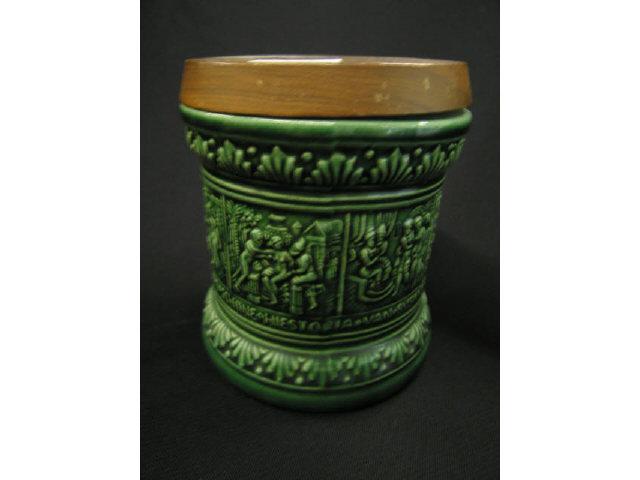 Appraisal: German Art Pottery Tobacco Jar bas-relief medieval scenes wooden cover