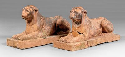 Appraisal: Pair French terra cotta lions recumbent lions each fitted with