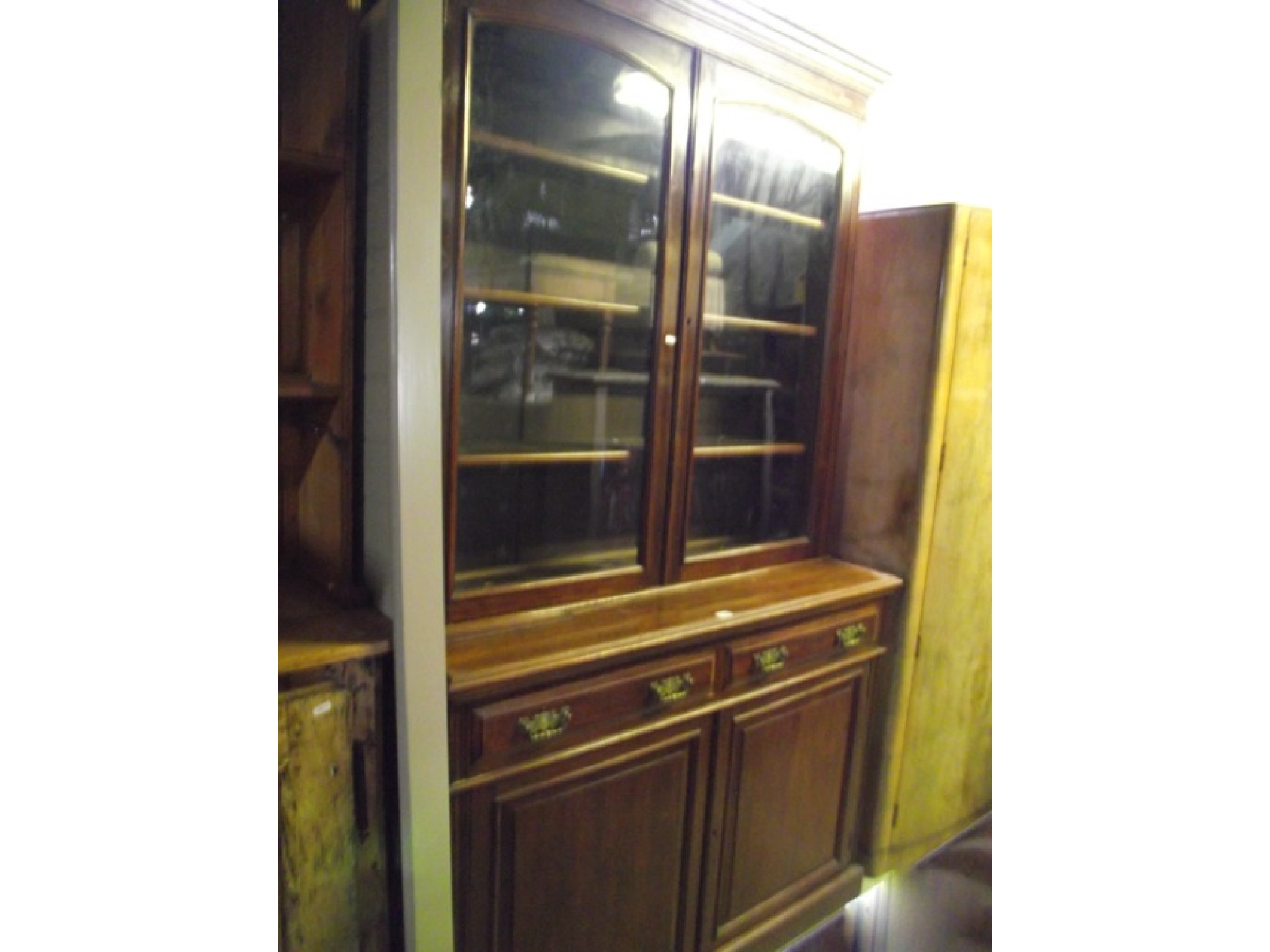 Appraisal: A late Victorian walnut library bookcase the upper section with