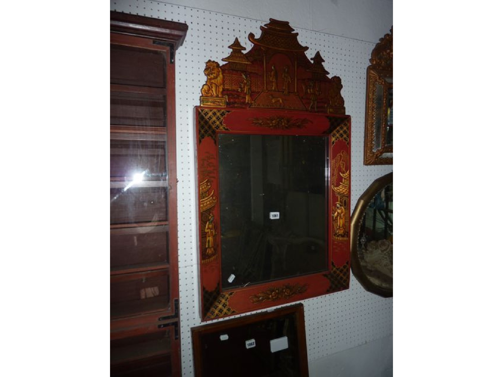 Appraisal: A th century wall mirror with crimson and gilt chinoserie