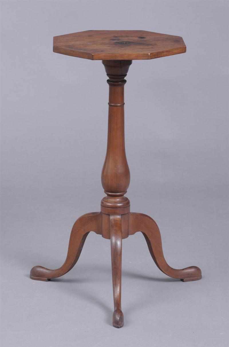 Appraisal: AMERICAN CHIPPENDALE CHERRY TRIPOD CANDLESTAND The two-piece octagonal top on