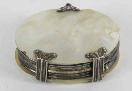 Appraisal: A mother-of-pearl cased magnifying glass with silver mounts unmarked cm