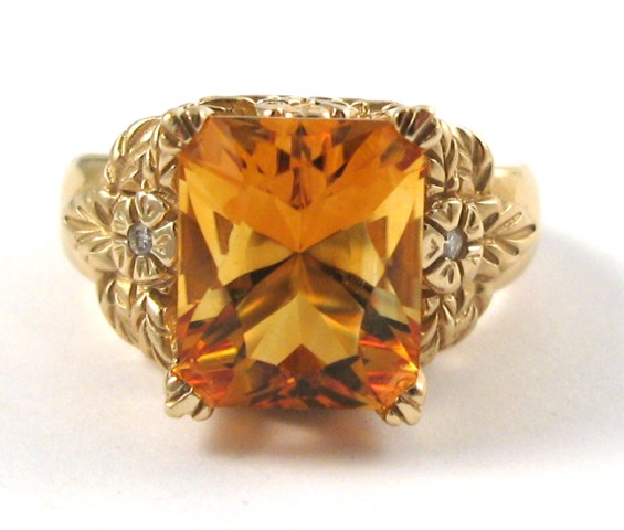 Appraisal: CITRINE DIAMOND AND FOURTEEN KARAT GOLD RING centering a rectangular